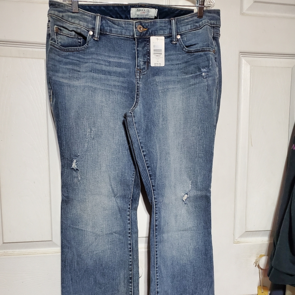 New with tags, Torrid distressed bootcut jean. 16